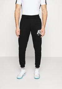 Nike Performance - M NK DF FC FLC PANT - Jogginghose - black white Thumbnail-Bild 1