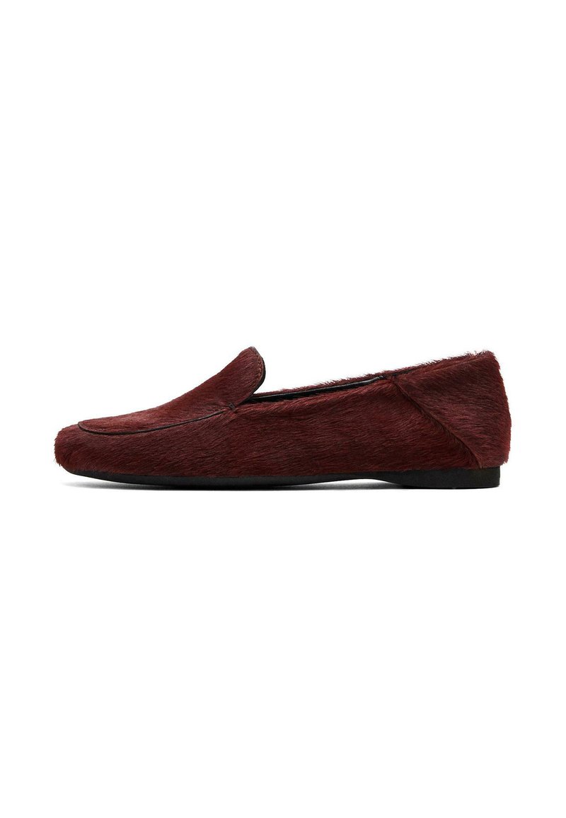Burgundy slip-on loafer made of soft fur-like material with a rounded toe and minimal stitching detail. Flat black rubber sole.