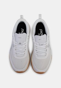 White athletic shoes with a mesh upper, lace closure, and rubber sole. Features textured pattern and branded insoles with a gray accent.