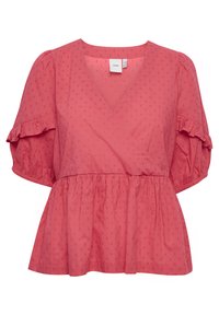 Blouse en corail rose avec des manches courtes bouffantes, un décolleté en V et une taille froncée. Tissu texturé avec de petits points en relief.