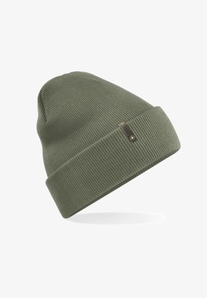 Green knitted beanie with a ribbed texture, featuring a folded cuff and a small label with a logo on the side.