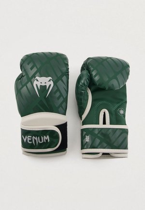 Zelené boxerské rukavice zo syntetického materiálu s lesklým povrchom, polstrovaním a zápästným pásikom na suchý zips. Obsahujú logo Venom.