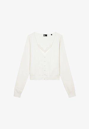 Cardigan blanc avec un décolleté en V, des manches longues et six boutons. Détail en dentelle sous le col. Matière en maille douce.