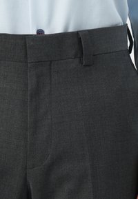 Gray dress trousers with a smooth texture, featuring a flat front, angled pockets, and a slim waistband with belt loops.