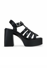 Black platform sandals with a chunky heel. Features an open design with multiple horizontal straps and a side buckle for adjustment.