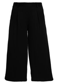 Pantalons larges noirs en tissu lisse, avec une taille haute dotée de plis et un design épuré. Pas de matériel visible.