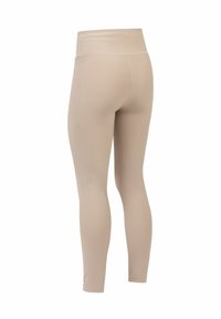 Beige ribben leggings met een hoge tailleband, voorzien van een strakke uitstraling die naar de enkels smal toeloopt en subtiele stikdetails heeft.