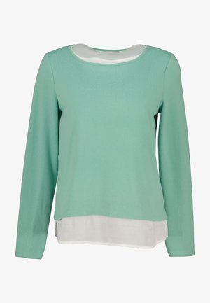 Mint green long-sleeve sweater with a rounded neckline, layered over a white bottom hem, made of soft, lightweight fabric.