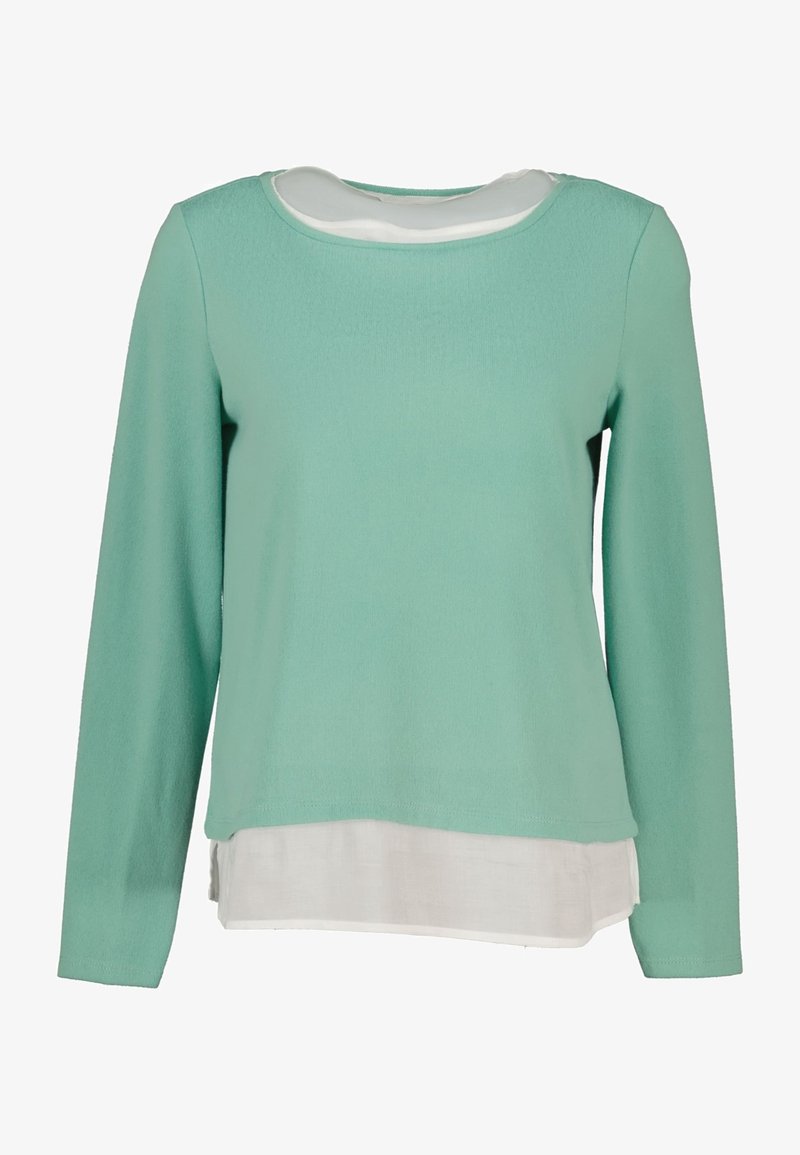 mintgrüner Langarmpullover mit rundem Ausschnitt, über einem weißen unteren Saum geschichtet, aus weichem, leichtem Stoff gefertigt.