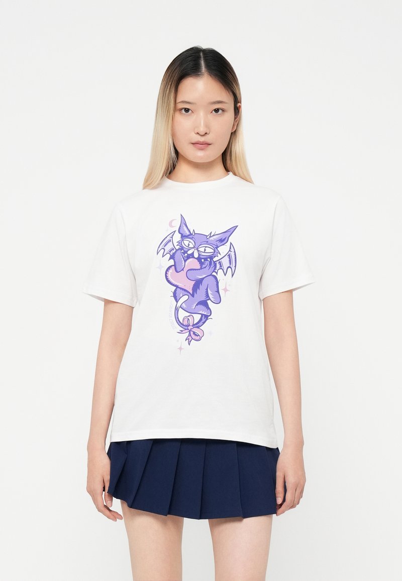 White cotton t-shirt featuring a whimsical purple bat graphic holding a heart, with accents of stars and a crescent moon.