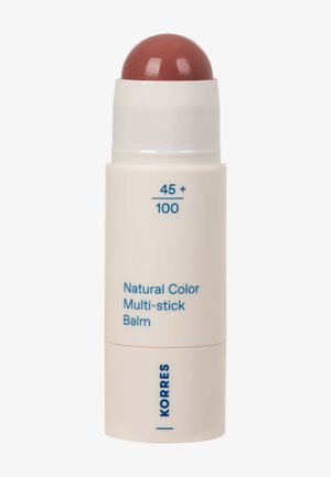 Natural Color Multi-stick Balm in beige twist-up tube with rounded brown balm exposed, labeled "45+ / 100" and brand name Korres in blue.