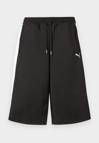 Μαύρα αθλητικά σορτς σε μήκος μέχρι τα γόνατα με λευκές πλευρικές ρίγες, ελαστική μέση με κορδόνια, τσέπες με φερμουάρ και λογότυπο Puma στο δεξί μηρό.