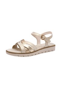 Guld- og beige strappy sandal med polstret sål, gummisål og justerbar ankelrem. Har metalliske accenter og teksturerede remme.