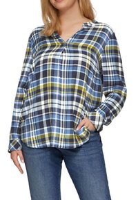 Geruite blauwe, groene en zwarte blouse. Lange mouwen, v-hals en een relaxte pasvorm met zijzakken. Glad katoen.