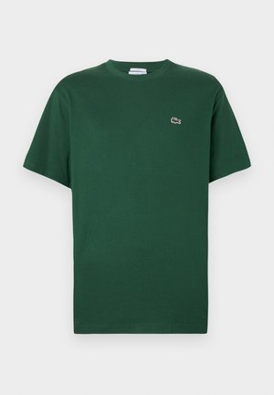 Groene katoenen t-shirt met een ronde hals, korte mouwen en een geborduurd krokodillenlogo op de linkerborst.