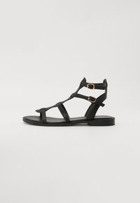 Varrelliset sandaalit - black