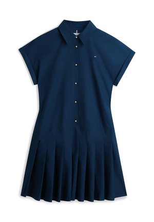 Haljina košulja tamnoplave boje s kratkim rukavima, zlatnim gumbima, klasičnim ovratnikom, plisiranom suknjom i malim logom na prsima.