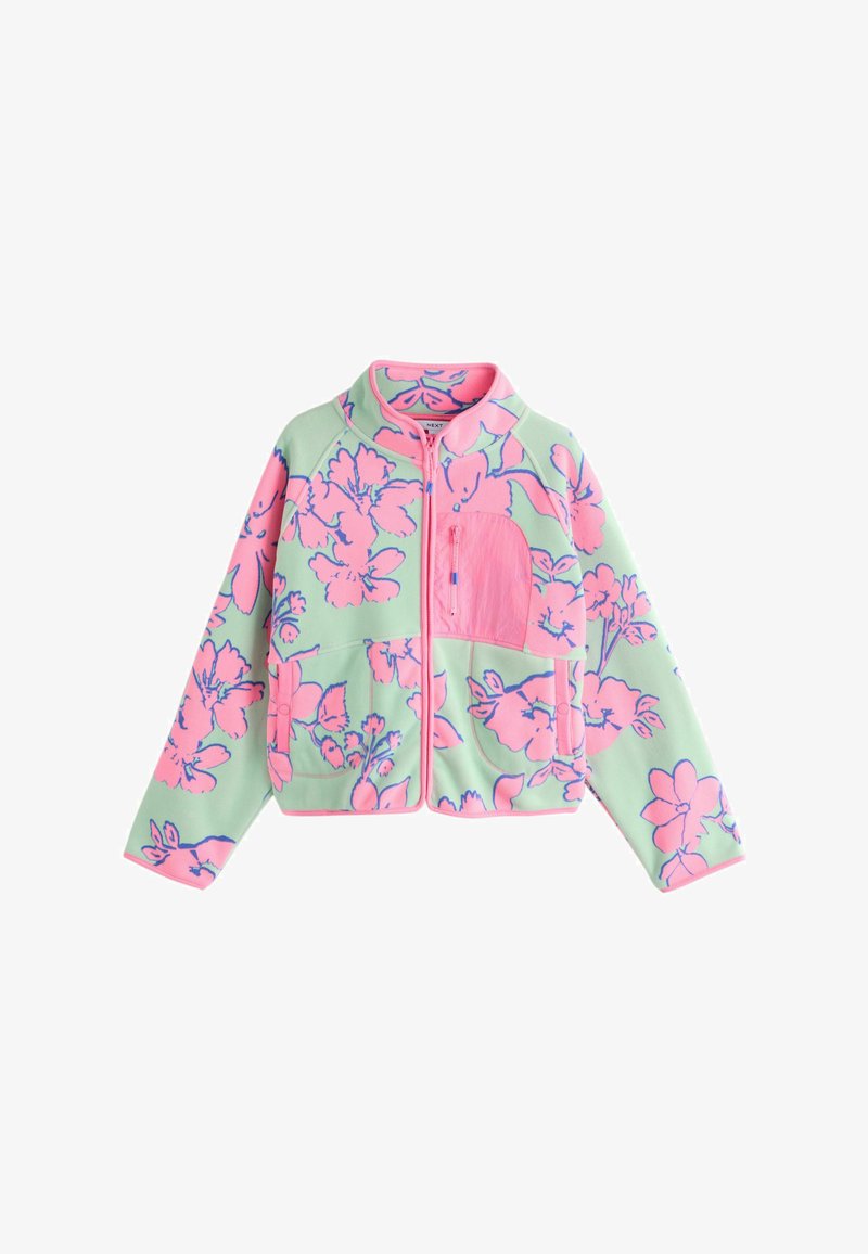 Veste zippée vert clair avec un grand motif floral rose et une poche poitrine unie rose, dotée de manches longues et d'un col montant.