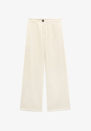Spodnie o szerokich nogawkach w kremowej tkaninie sztruksowej, z pionowymi paskami, z zapięciem na guzik i kieszeniami z przodu. Teksturowana, miękka powierzchnia.