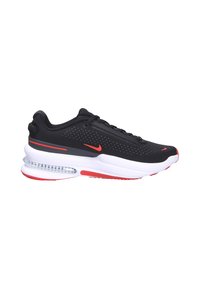 Zapatillas deportivas negras con un upper texturizado, acentos rojos y una suela intermedia blanca que presenta una unidad de amortiguación de aire visible. Diseño con cordones.