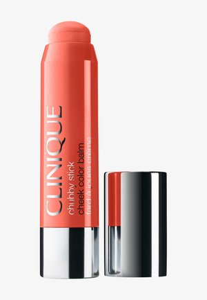 Baume coloreur pour joues Clinique Chubby Stick en teinte corail avec un capuchon argenté retiré et posé à côté du stick.