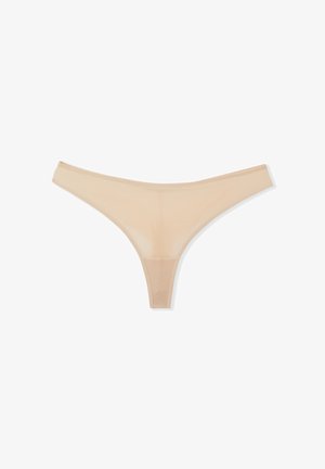Beige thong with a simple design, made of sheer fabric; features thin straps and minimal coverage for a discreet fit.