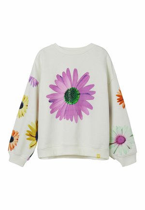 Sweatshirt blanc à manches longues, orné de grandes marguerites multicolores, dont une marguerite rose avec un centre vert bien visible sur l'avant.