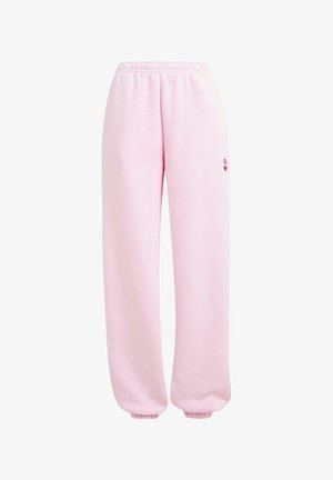 Heledad roosa dressipüksid, mis on valmistatud pehmest kangast, elastse vöökoha ja mansettidega, väikese punase südame logoga detailiga.