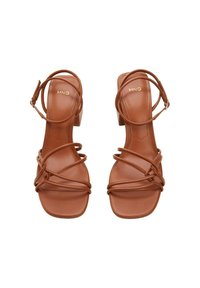 Brown heeled sandals featuring thin straps wrapped around the foot and ankle. Square toe design; smooth leather material with subtle branding.