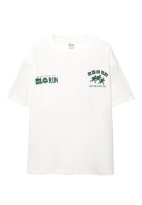 White cotton t-shirt with short sleeves. Green text reads “FOUR FIVE SIX” and “오징어 게임,” along with a graphic of running figures.