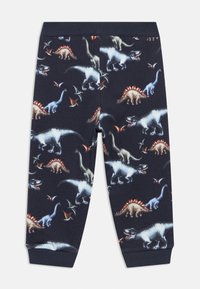 Παιδικό παντελόνι ναυτικού μπλε με εκτυπώσεις δεινοσαύρων και πτεροδάκτυλων σε αποχρώσεις του μπλε, μπεζ και πορτοκαλί, με ριμπ μανσέτες και ζώνη στη μέση.