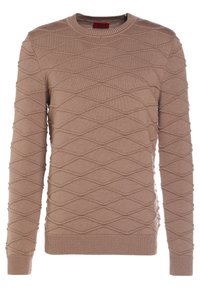 Beige gestrickter Pullover mit einem strukturierten Diamantmuster, Rundhalsausschnitt und gerippten Bündchen und Saum. Lange Ärmel und weicher Stoff.