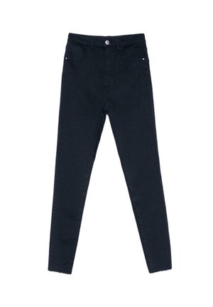 Jean skinny noir taille haute avec fermeture à boutons, poches avant et coutures minimales, posé à plat sur un fond blanc.