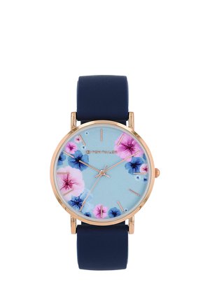 Round gold watch with blue leather strap, light blue dial featuring pink and blue floral patterns and thin gold hour markers and hands.