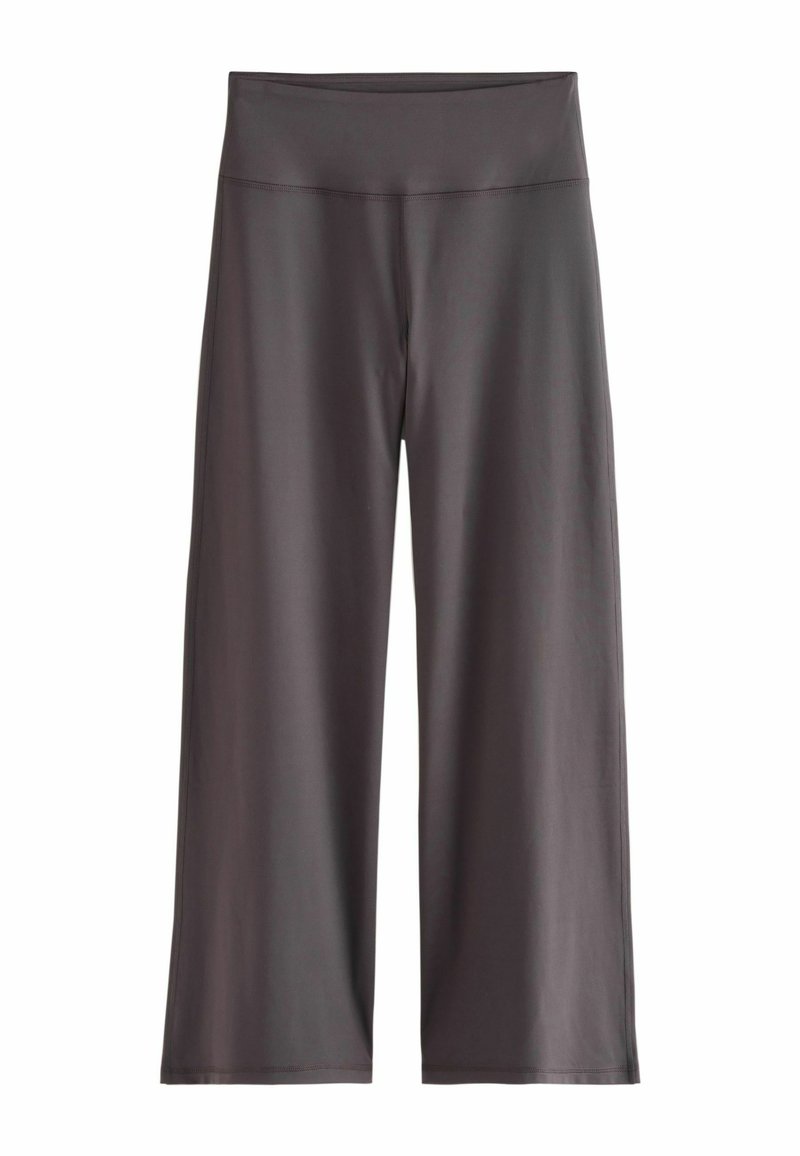 Pelēki platajās kājas treniņu bikses, kas izgatavotas no gludas auduma, ar augstu jostasvietu un bez redzamām šuvēm, izstrādātas komfortam un elastībai.