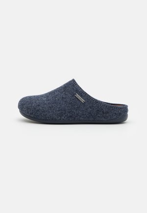 Dark blue felt slip-on slipper with a rounded toe, soft texture, and a rubber sole. Features a subtle logo accent on the side.