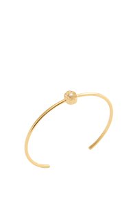 Pulsera de brazo de oro con una banda delgada y elegante y un pequeño acento floral con una gema central. Textura suave con un acabado pulido.