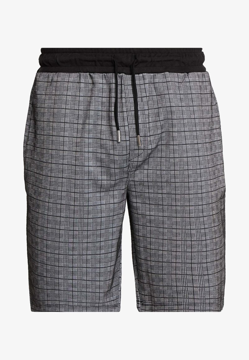 Shorts à carreaux noirs et blancs avec une taille élastique noire et un cordon de serrage noir aux extrémités argentées.