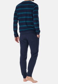 Navy blue striped long-sleeve shirt with teal accents, paired with matching navy jogger pants, both made of soft, breathable fabric.