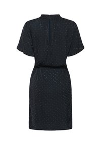 Vestido de marina hecho de tejido ligero, con mangas cortas, una cintura atada y una abertura en la espalda con un sutil patrón de lunares.
