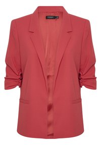 Blazer corallo con design sartoriale, spalle strutturate e maniche arrotolate. Presenta una texture liscia e due tasche laterali.