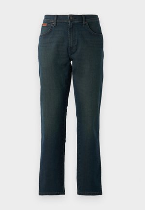 Tumed sinised teksad otse jala disainiga, varustatud nööbi ja lukuga kinnitusega, vöökandmistega ning kahe esimise taskuga.