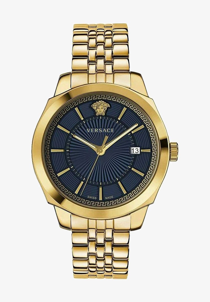 Gold-tone stainless steel watch with a navy dial, octagonal case, striped pattern, and Versace logo. Date display at 3 o'clock position.