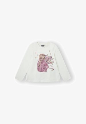 Camiseta blanca de manga larga con una ilustración de una niña de cabello trenzado sosteniendo flores, con acentos en rosa y morado y el texto "De Petits Bonheurs".