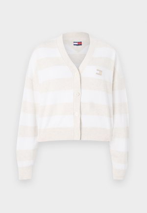 Cropped cardigan in soft cream and beige vertical stripes. Features a v-neck, button front, and a small logo accent on the left side.