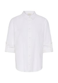 Chemise blanche longue à manches longues avec col, manches retroussées maintenues par des pattes boutonnées.