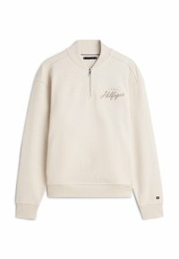 Felpa beige chiaro con collo alto, zip a un quarto e polsini a costine. Presenta un piccolo logo ricamato in beige scuro sul petto.