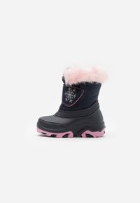Black waterproof boot with pink sole and faux fur collar. Features snowflake detail and contrasting stitching on a fabric upper.