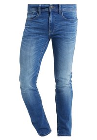 Blå blekta slim-fit denimjeans med framfickor, bälteshällor, knappstängning och subtila slitningar.