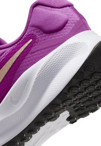 Purple athletic shoe with a textured upper, a gold accent, and a white midsole. Features a black rubber outsole with grip patterns.